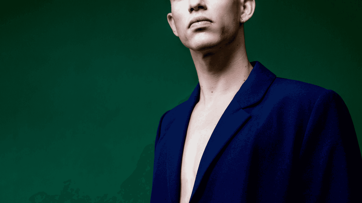 man wearing suit coat without a shirt