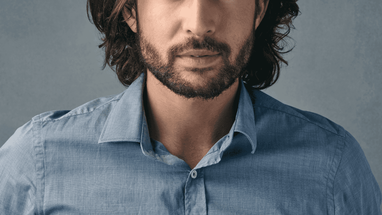 man with hair just above his shoulders