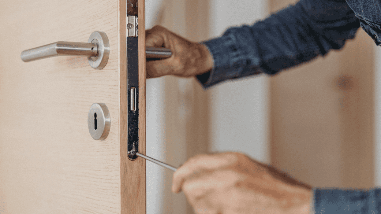 Man working on door lock