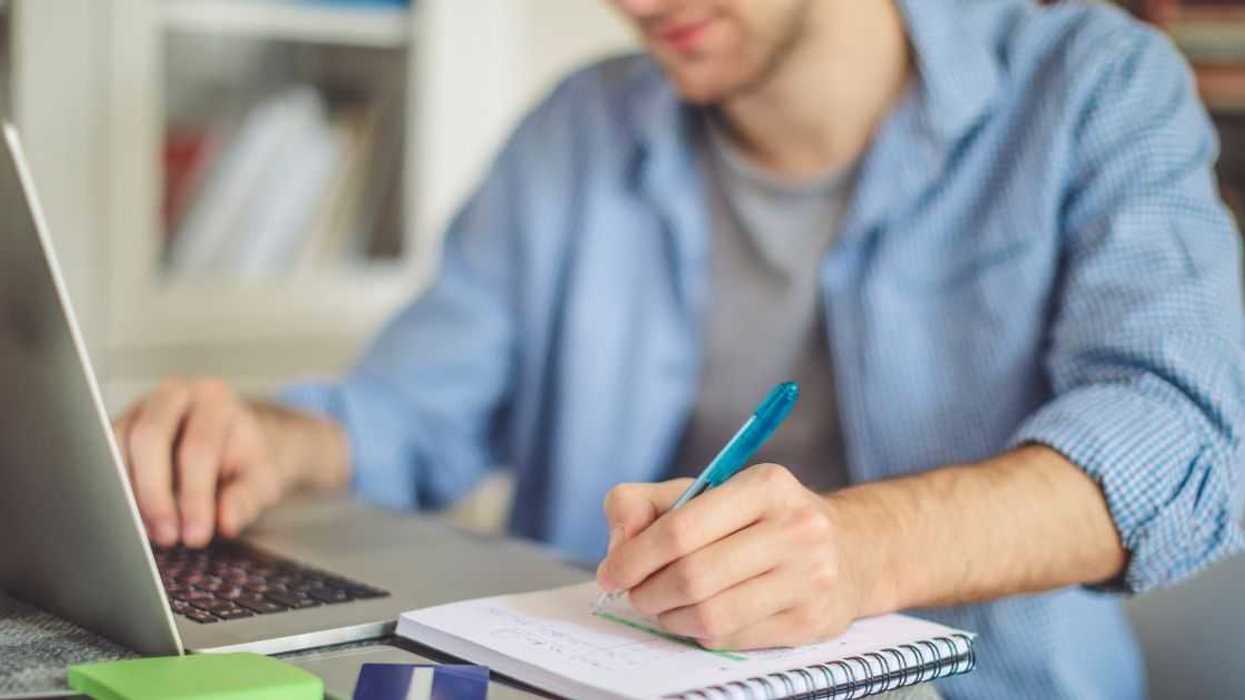 Man working on laptop at home