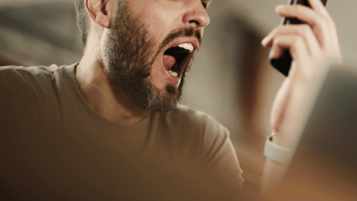 Man yelling after reading text message