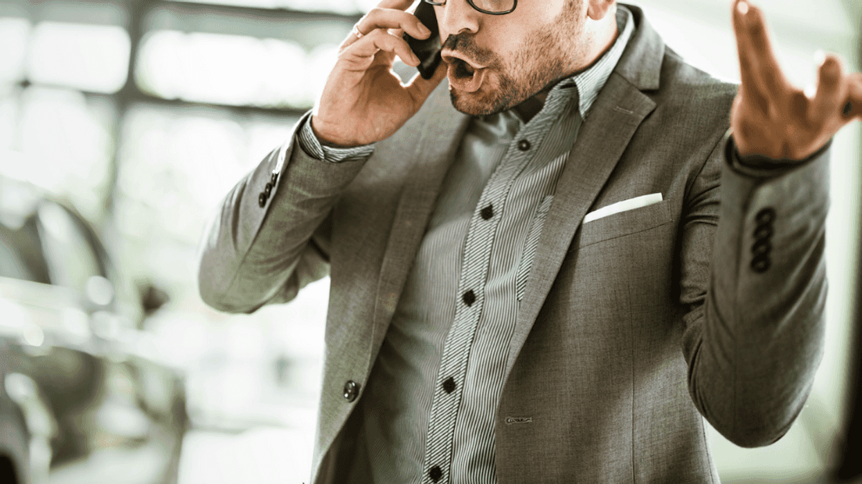 Man yelling into phone.