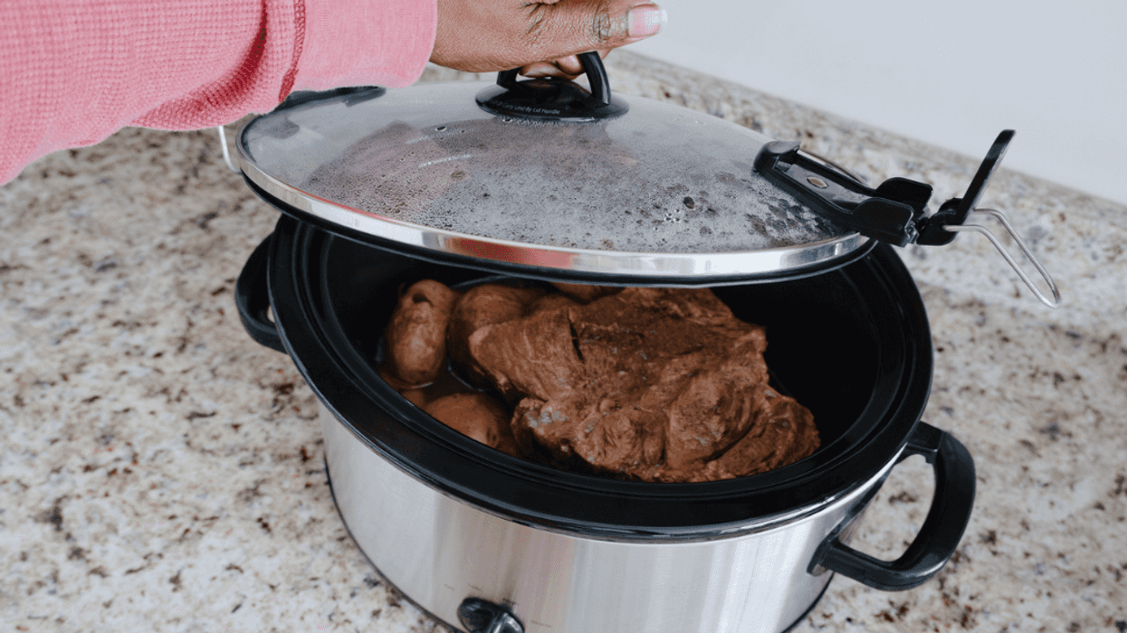Meat cooking in a crock pot.