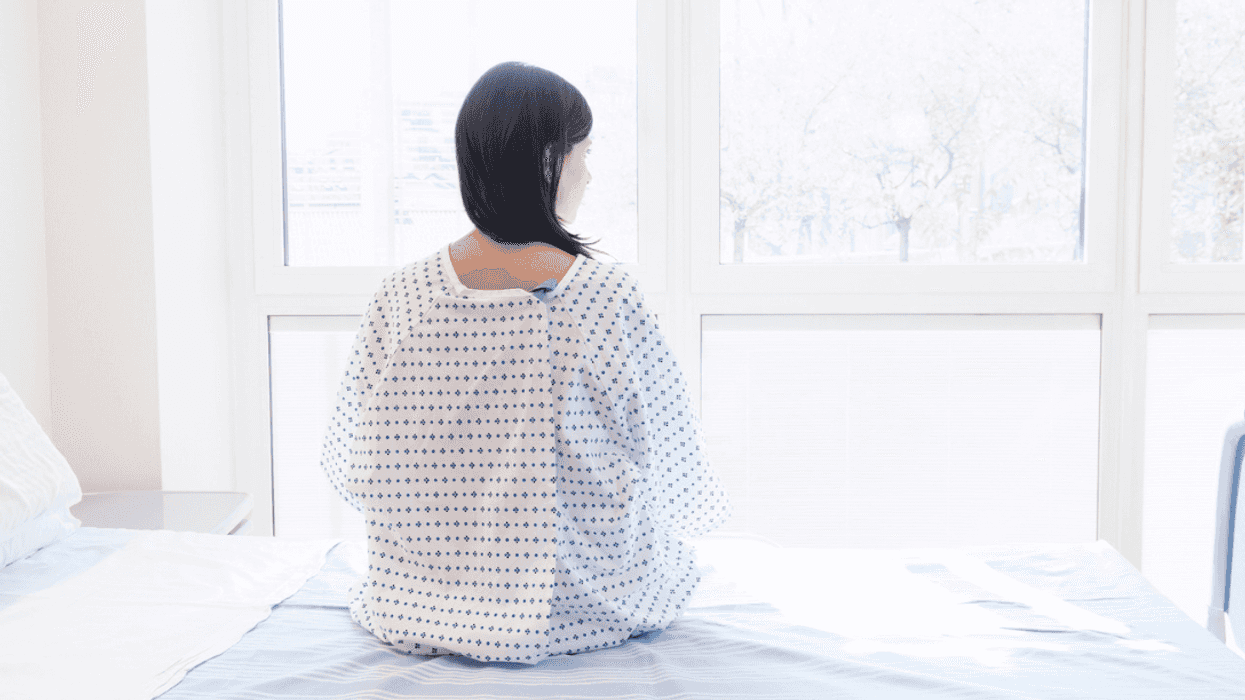 Medical patient sitting in hospital bed
