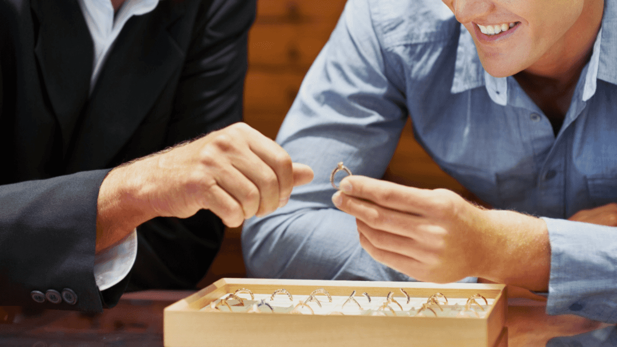 men looking at engagement rings
