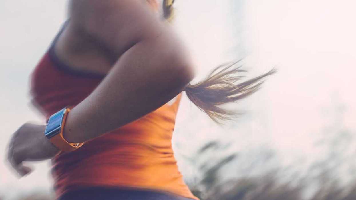 Mid-body shot of a woman running
