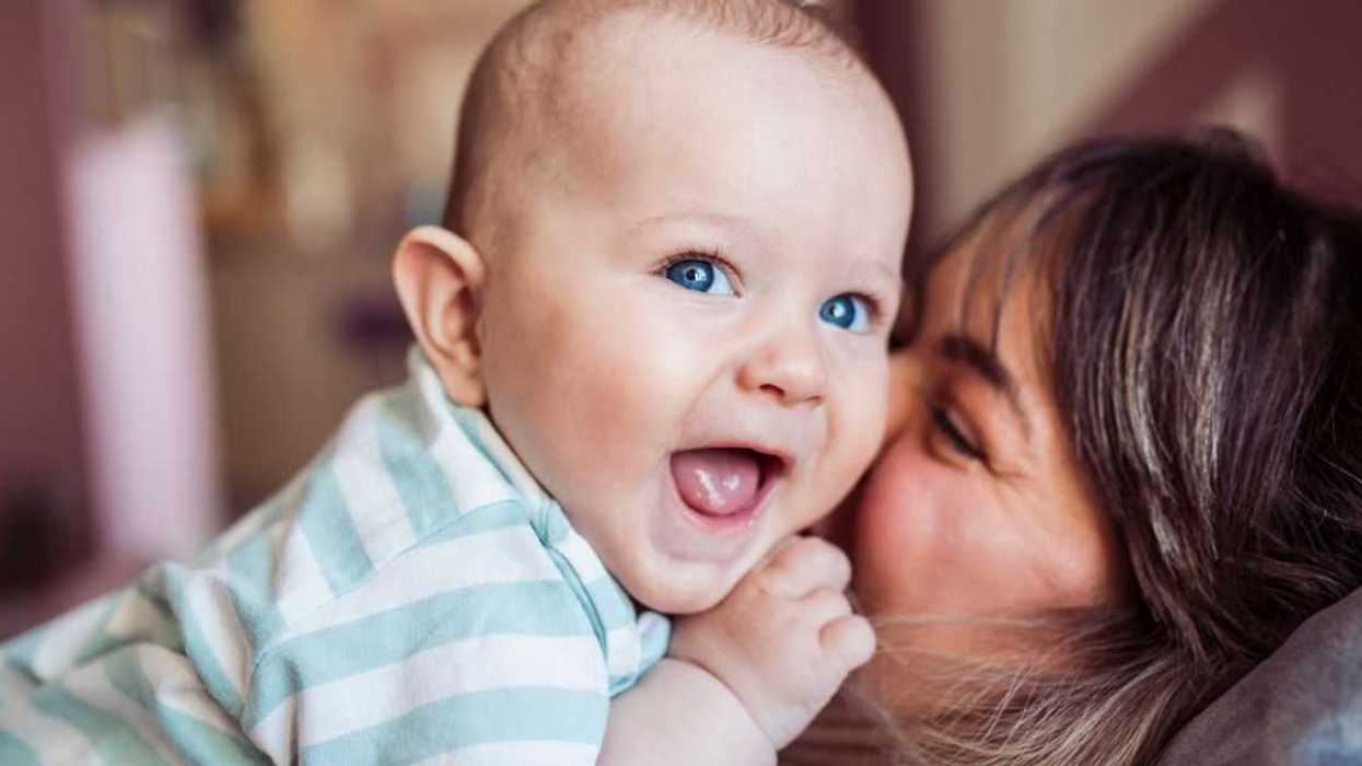 Mom and baby boy having fun