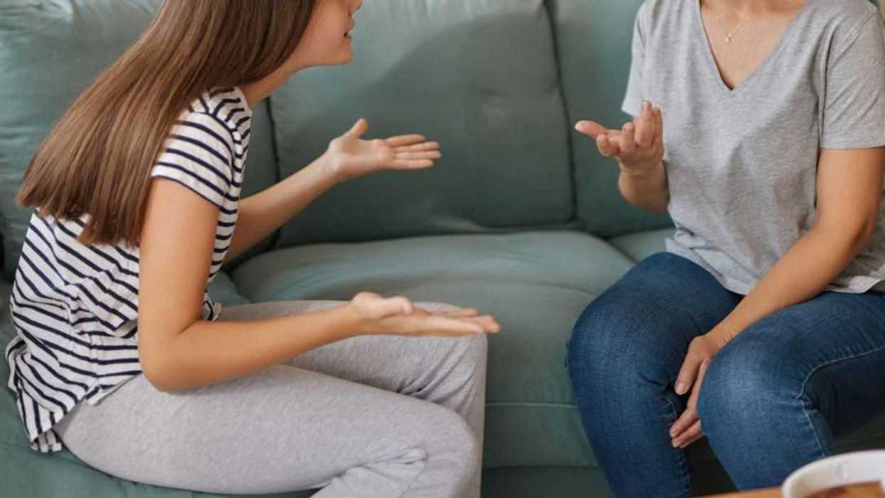 Mother and daughter are having a disagreement, highlighting the challenges of raising a teenager.