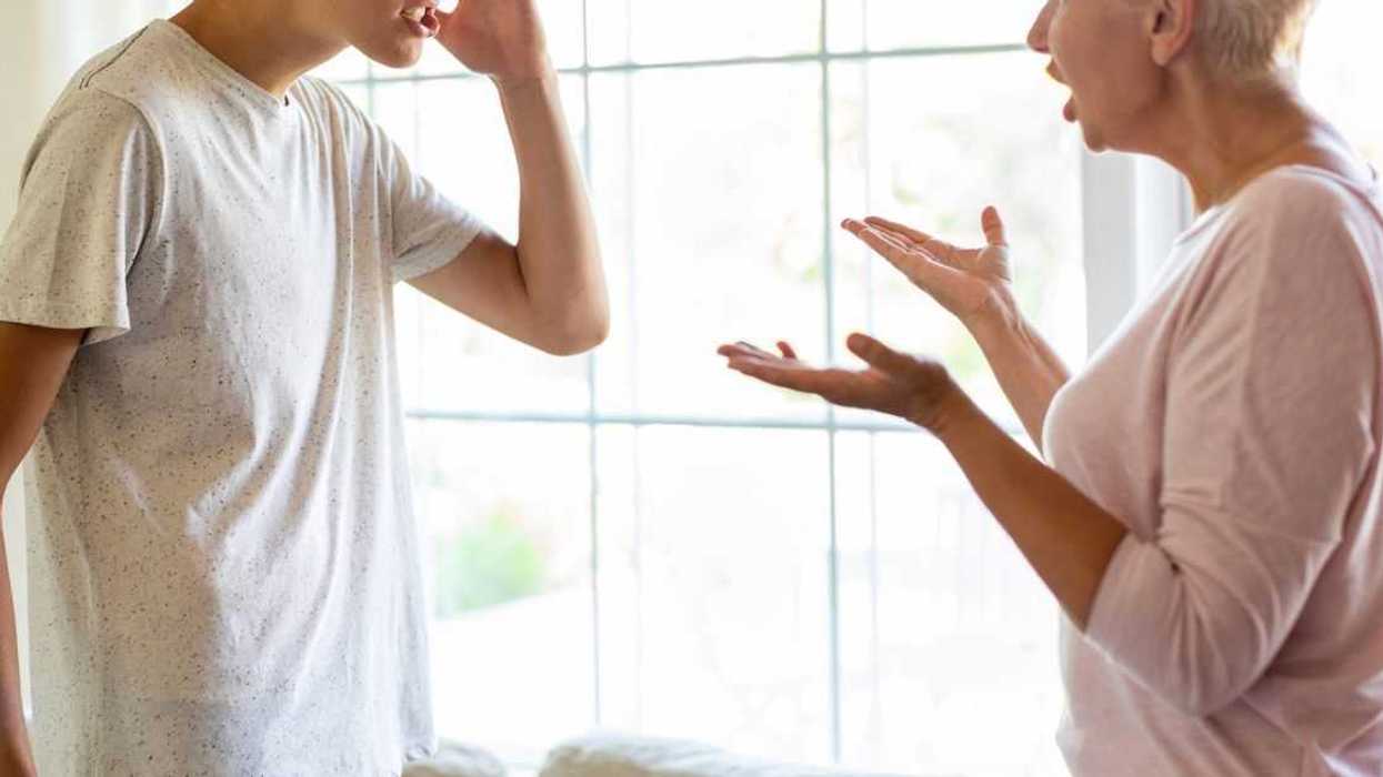 Mother and her teenage son argue at home.
