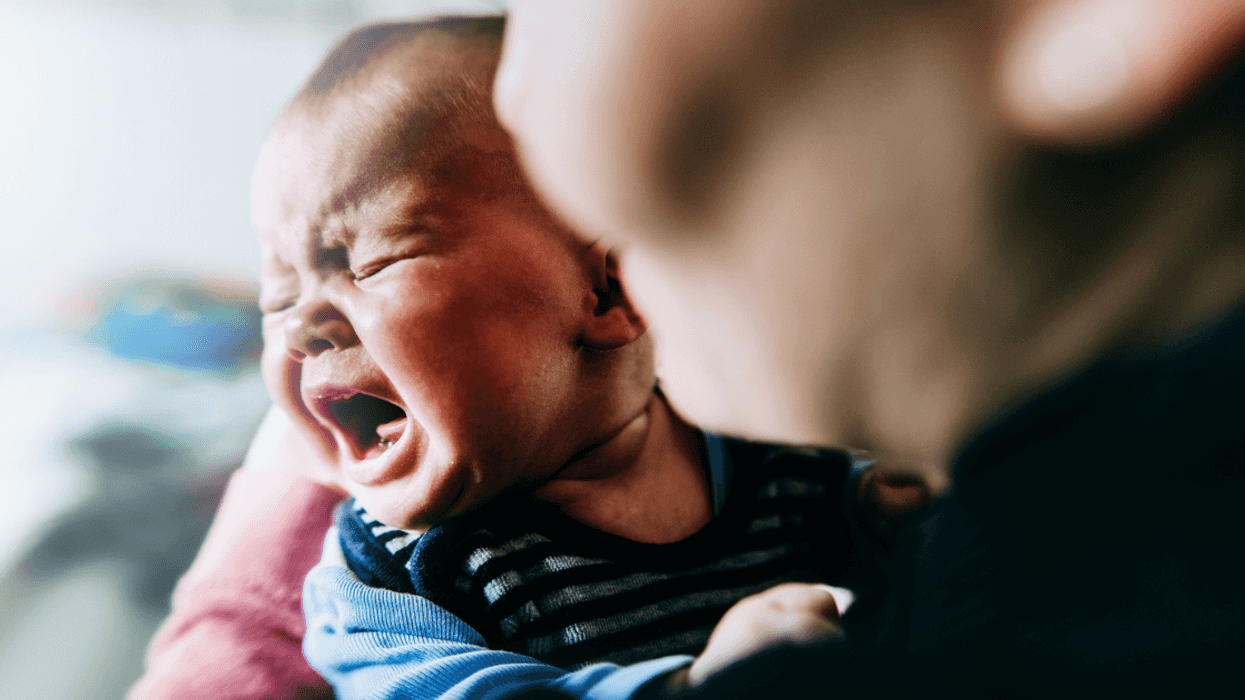 Mother comforting crying baby