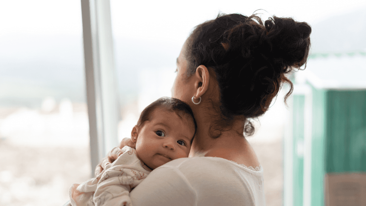 mother holding baby