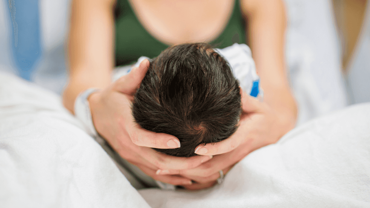Mother holding her newborn baby