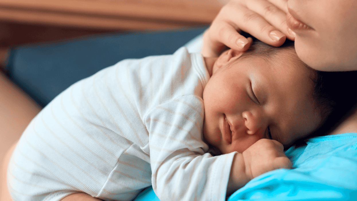 Mother holding newborn baby