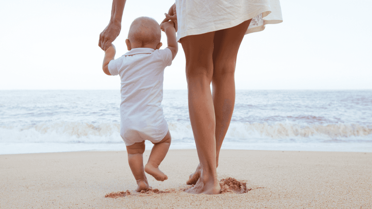 Nanny wtih baby on the beach