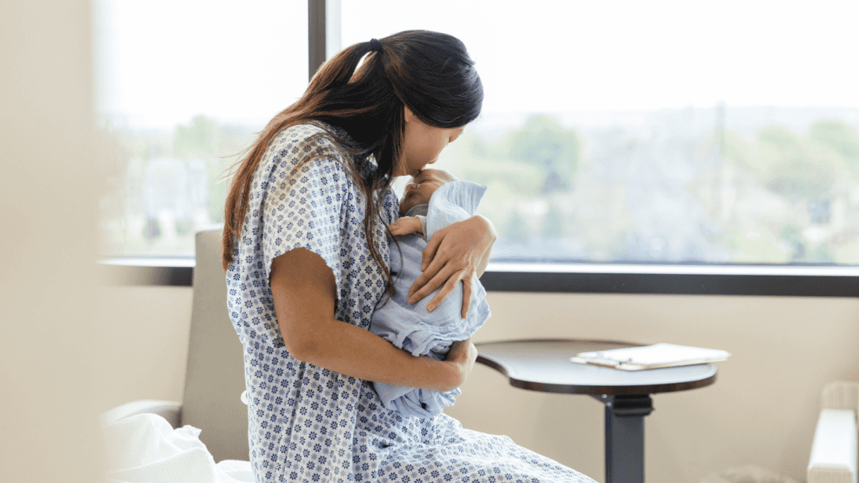 New mom holding her baby in the hospital