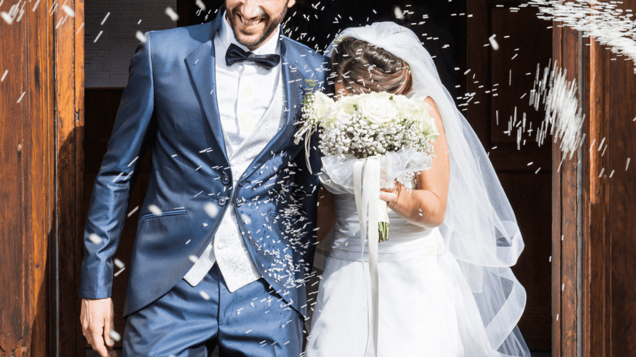 newly married couple leaving church