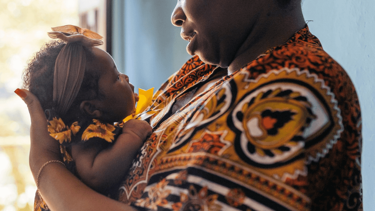 Nigerian mother holding baby girl