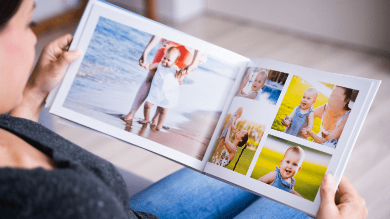 older mother looking at baby photos