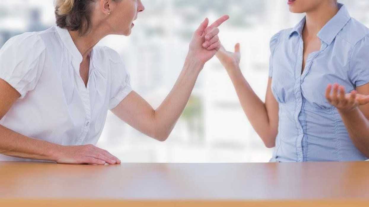 older woman berating younger woman