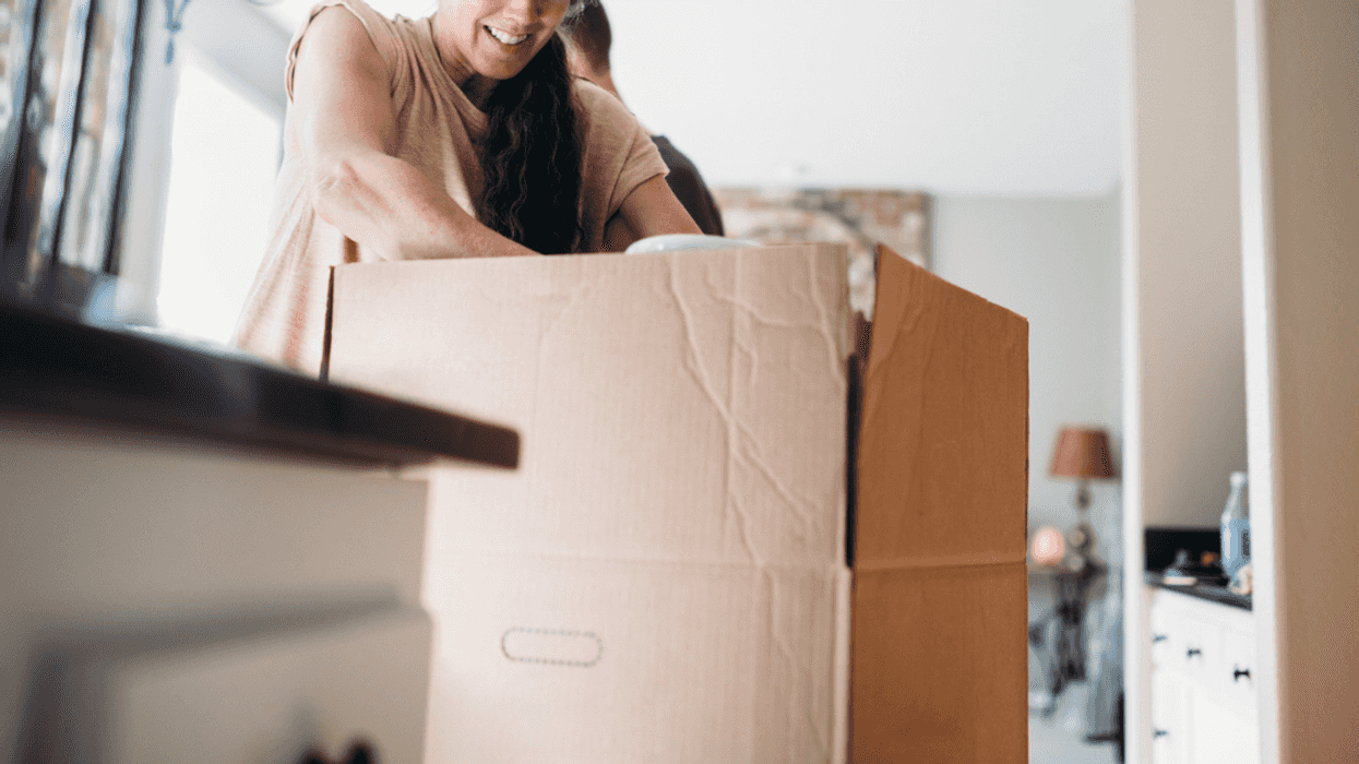 Older woman with moving boxes