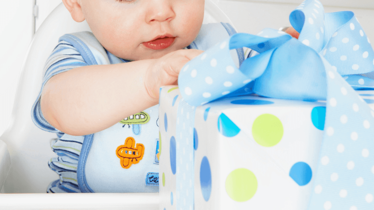 one-year-old boy with a birthday gift