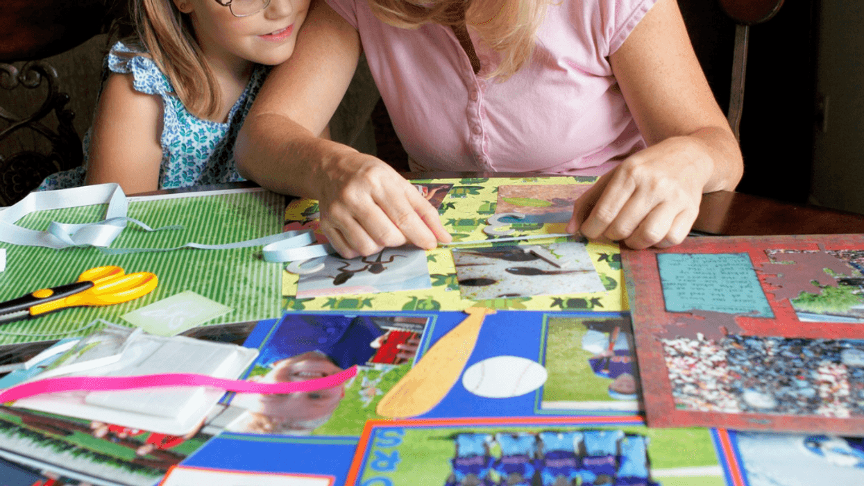 parent and child making a scrapbook