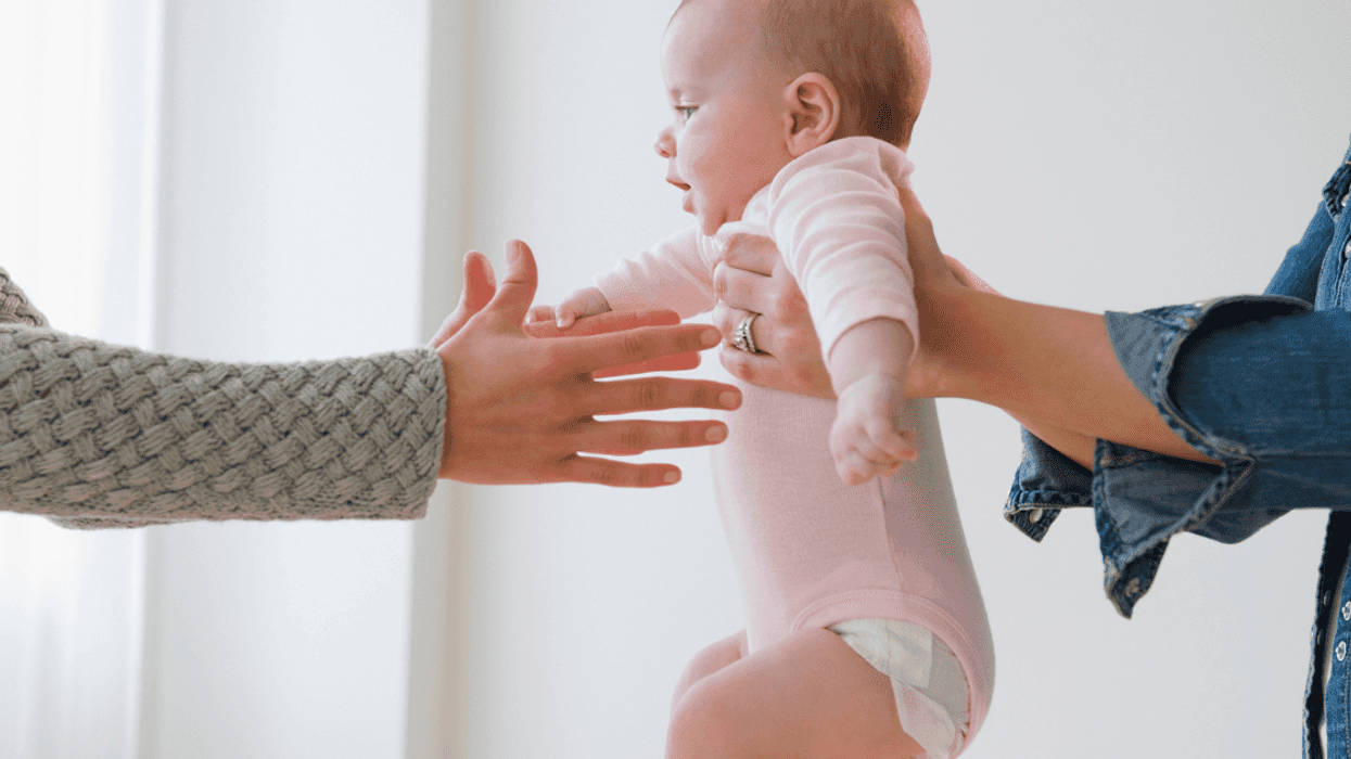 People holding a baby