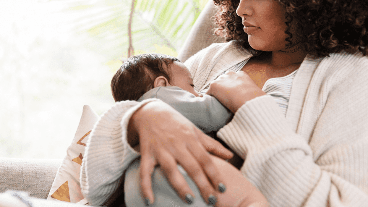 person breastfeeding infant