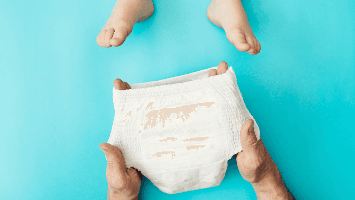 Person changing child's diaper