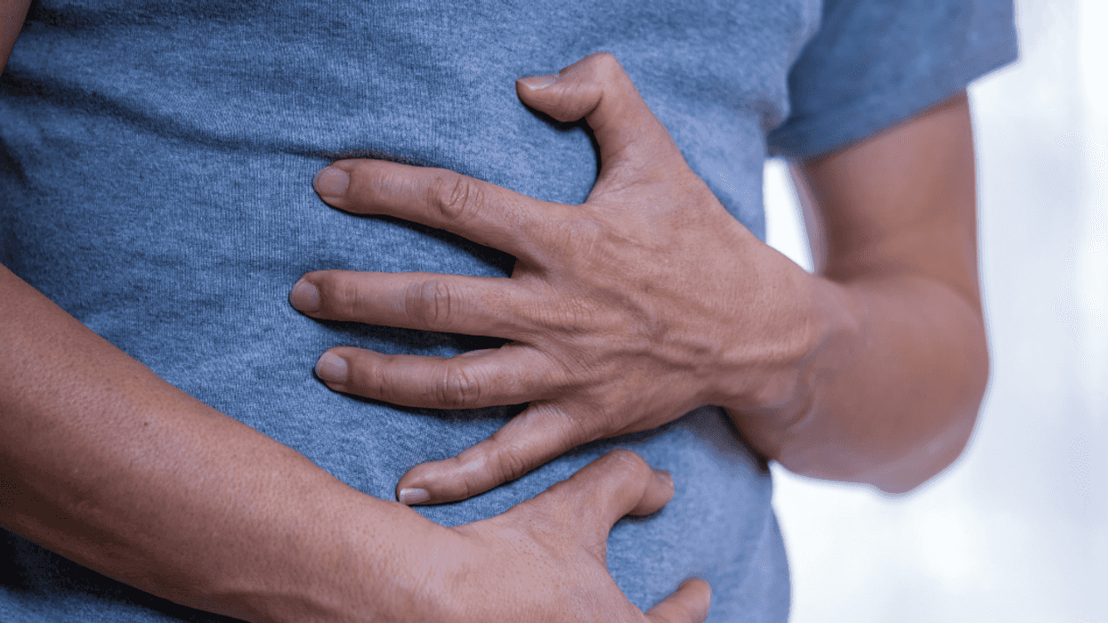 person clutching their abdomen