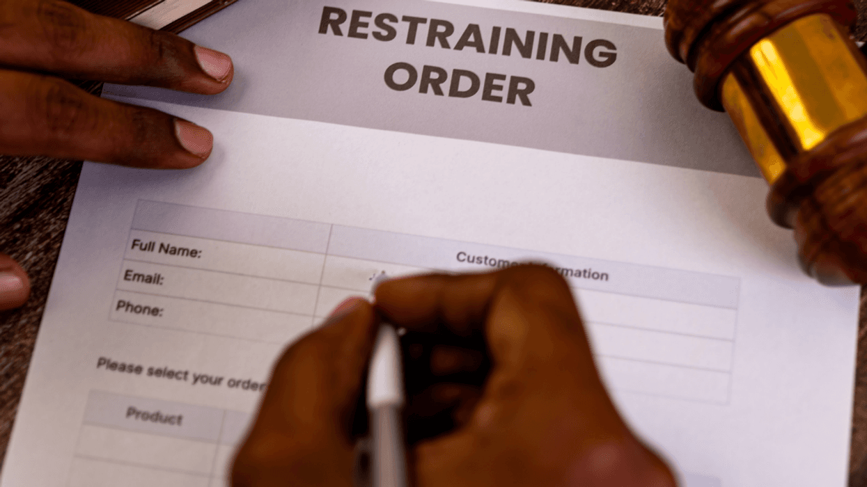 person filling out restraining order