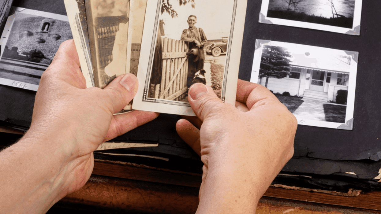person going through old photos