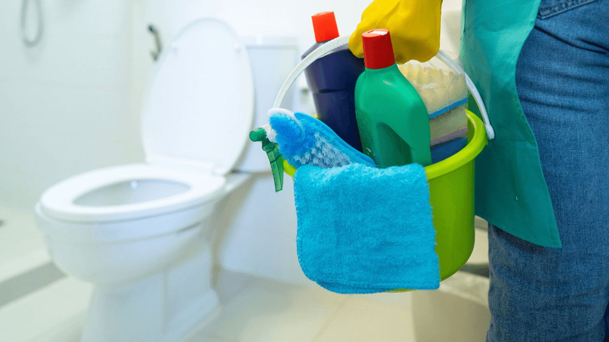 person going to clean toilet