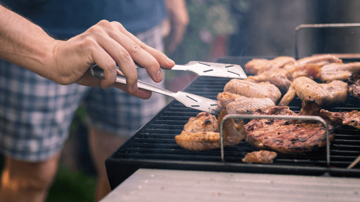 Person grilling meats