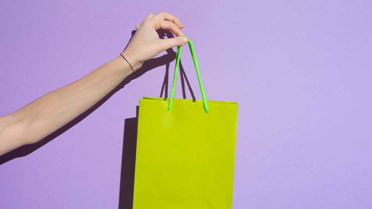 person holding gift bag