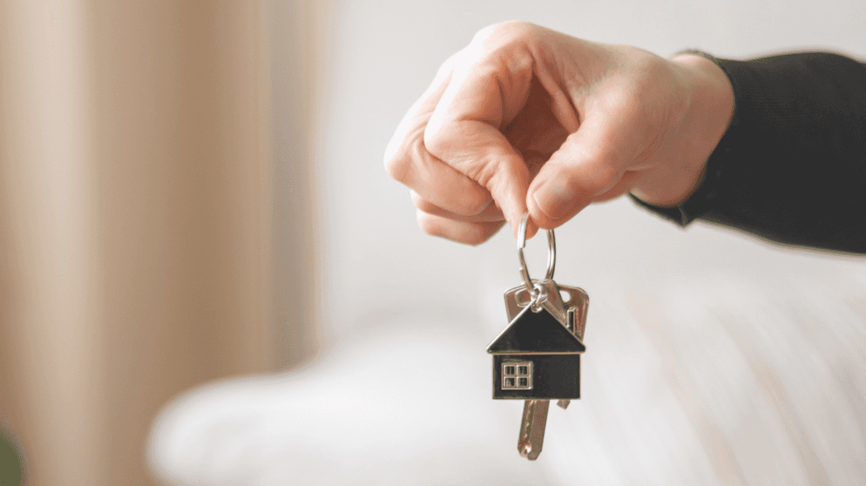 person holding house key