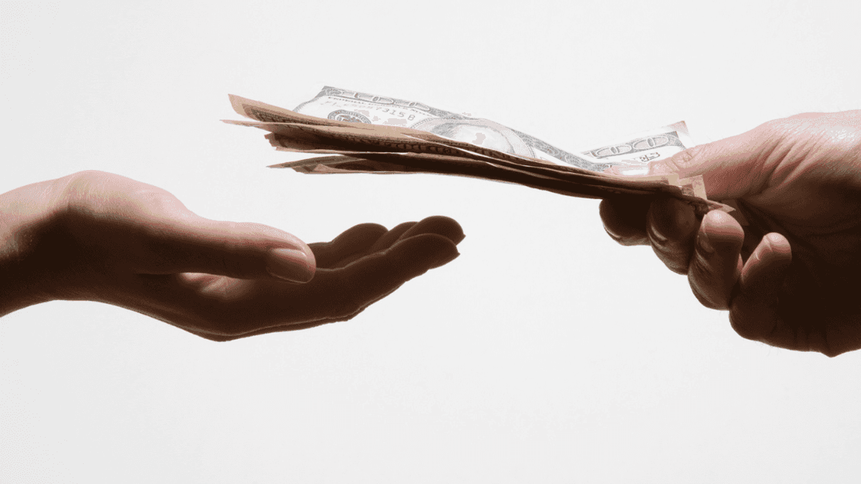 Person holding out money