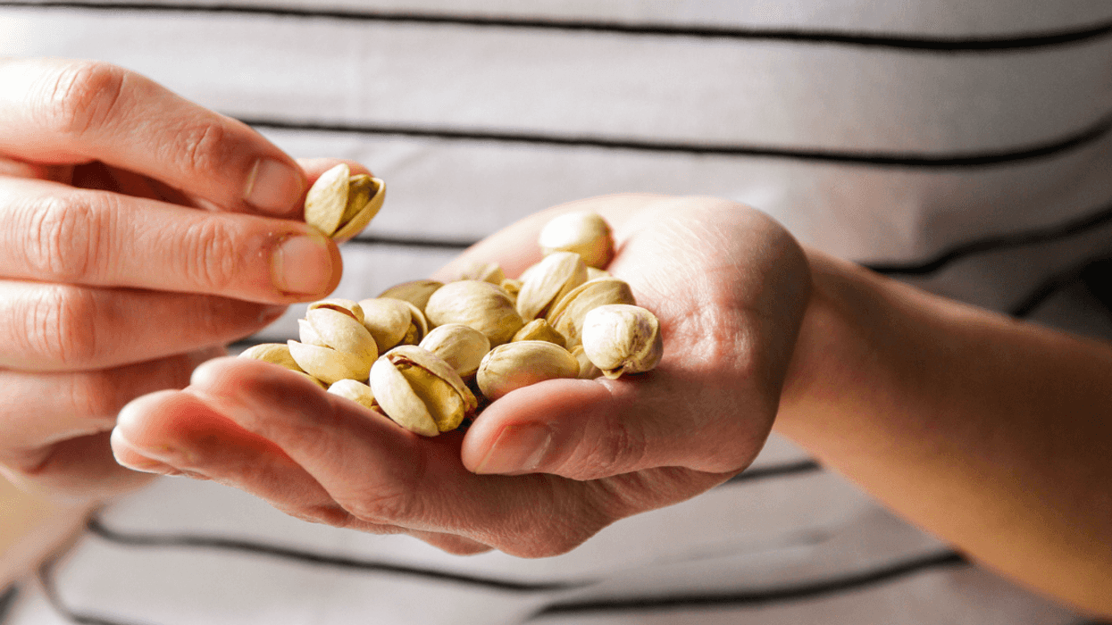 Person holding pistachios