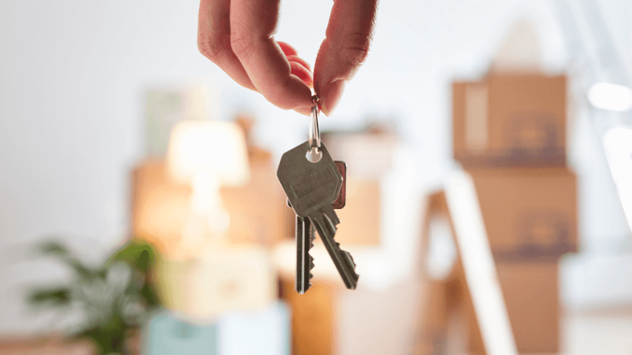Person holding the keys after buying a house