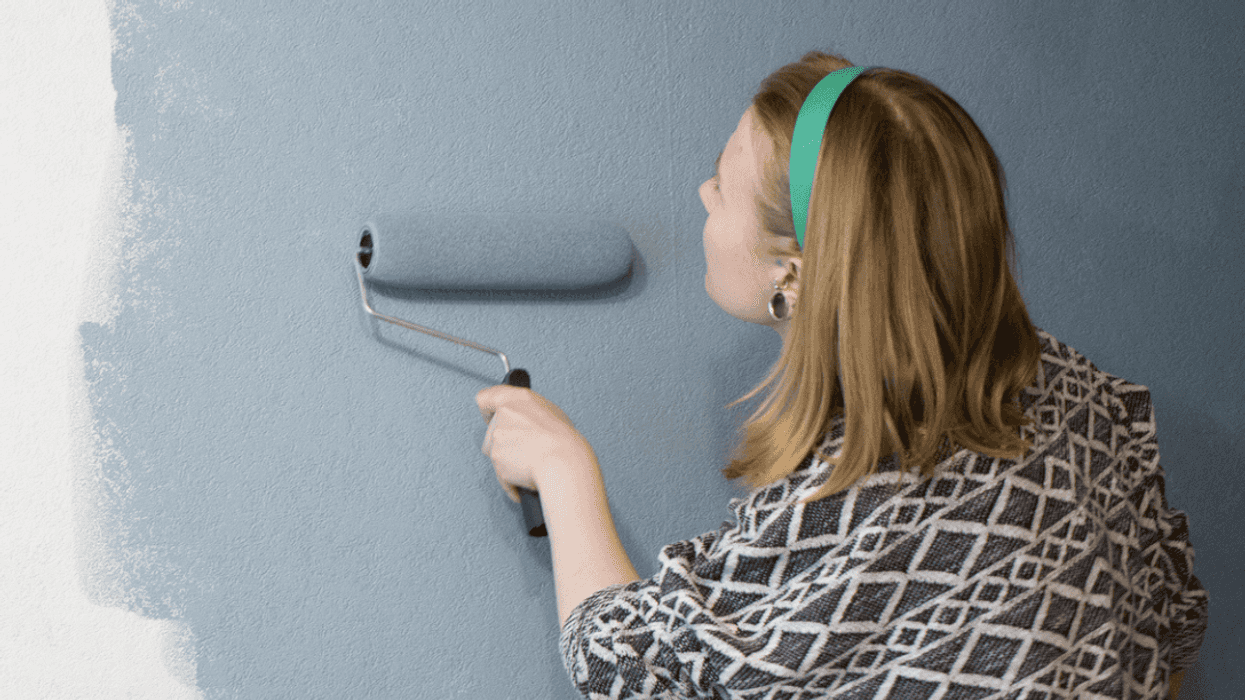 Person painting a room