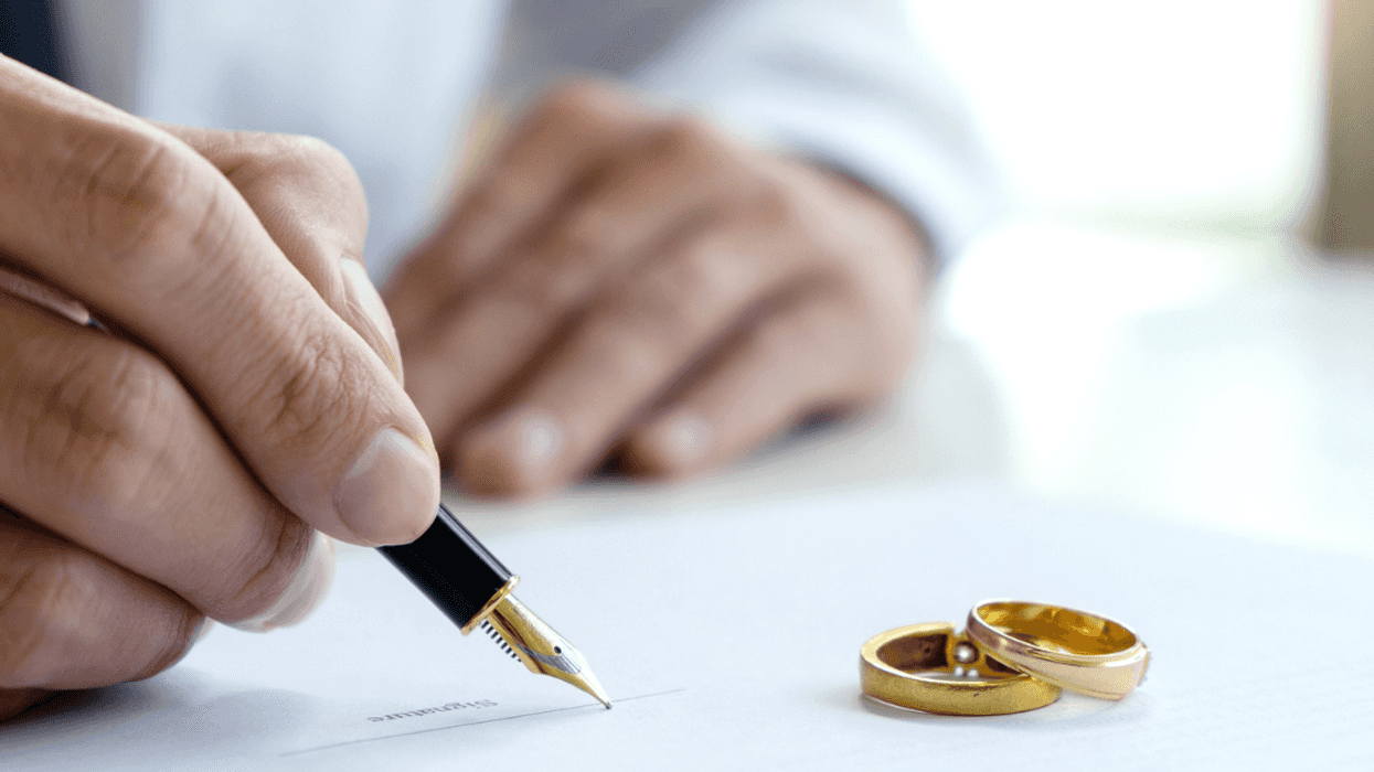 Person signing a prenuptial agreement