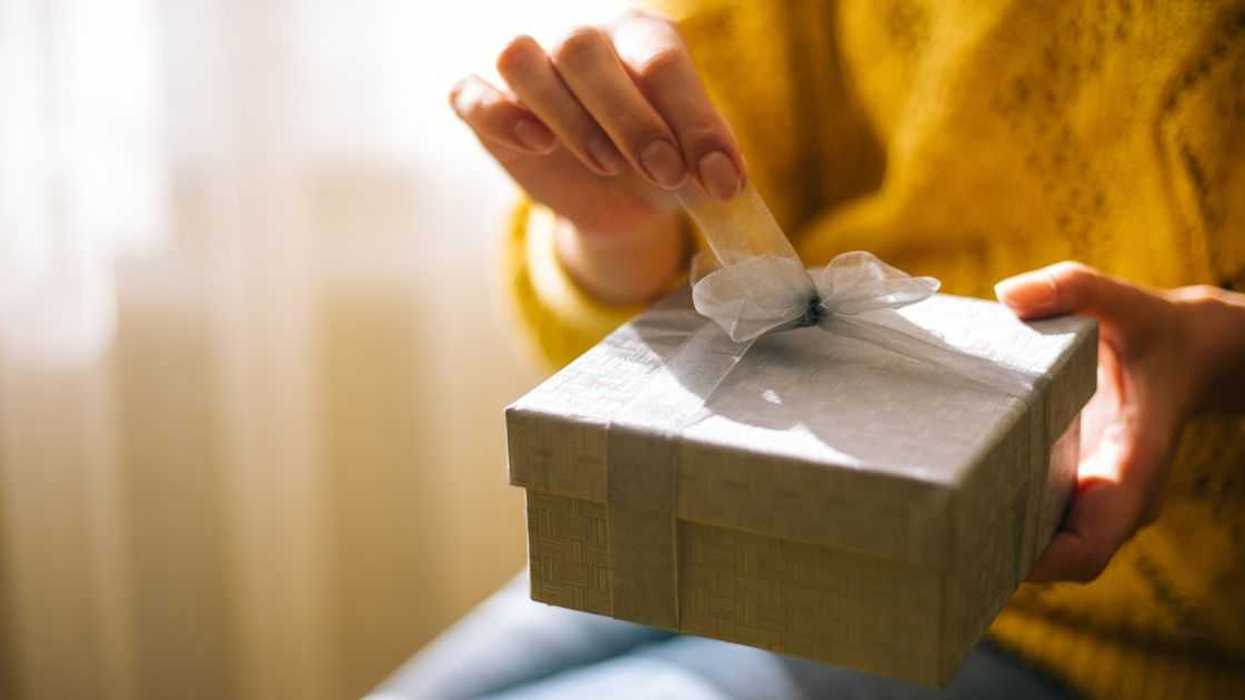 Person unwrapping present
