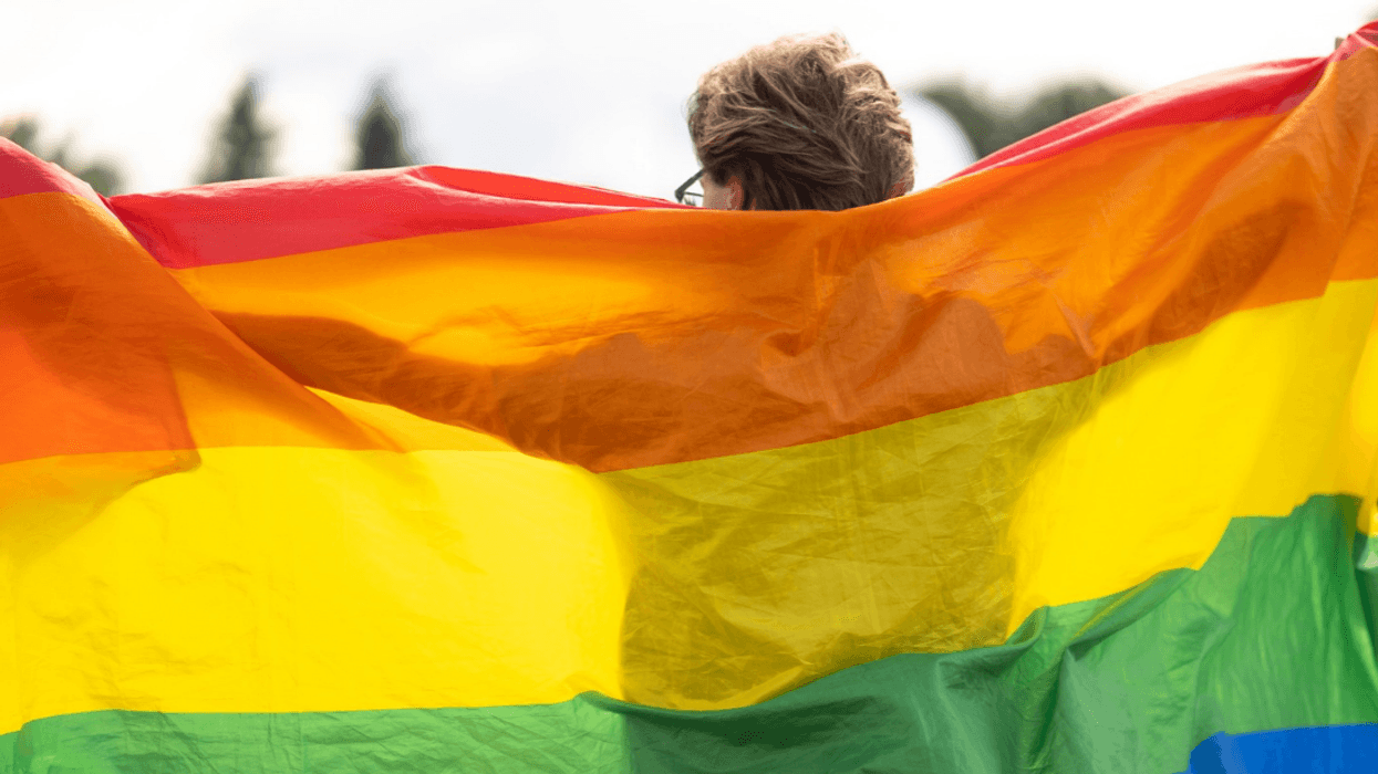 Person waving Pride flag