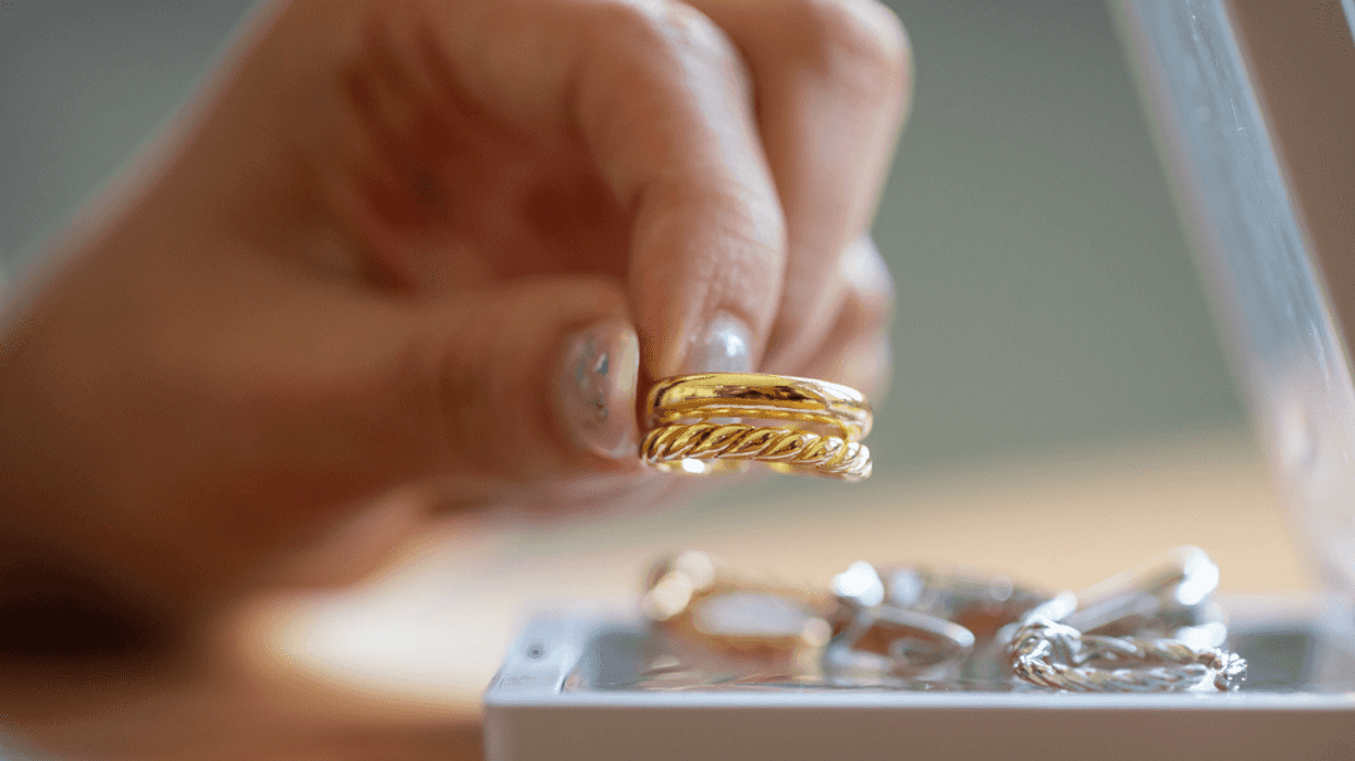 Person with jewelry tray