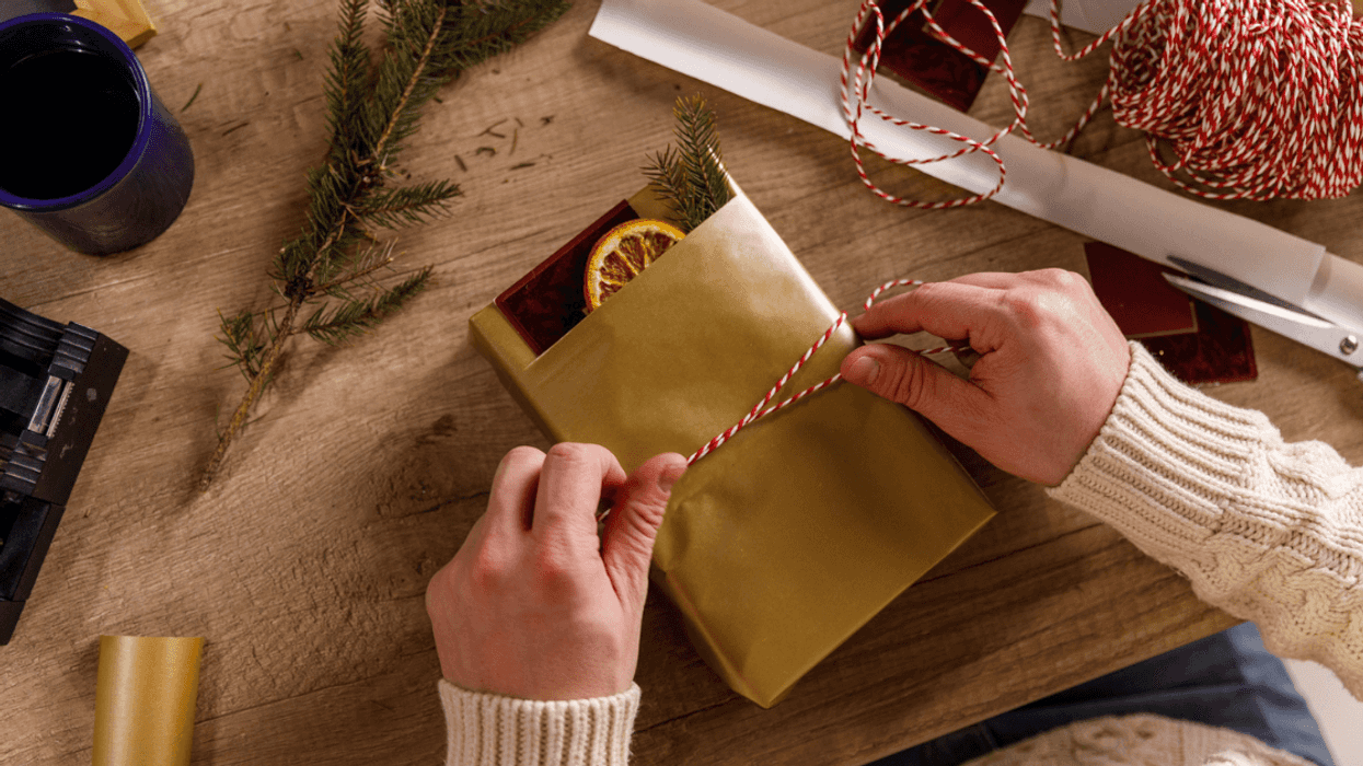 person wrapping handmade gift