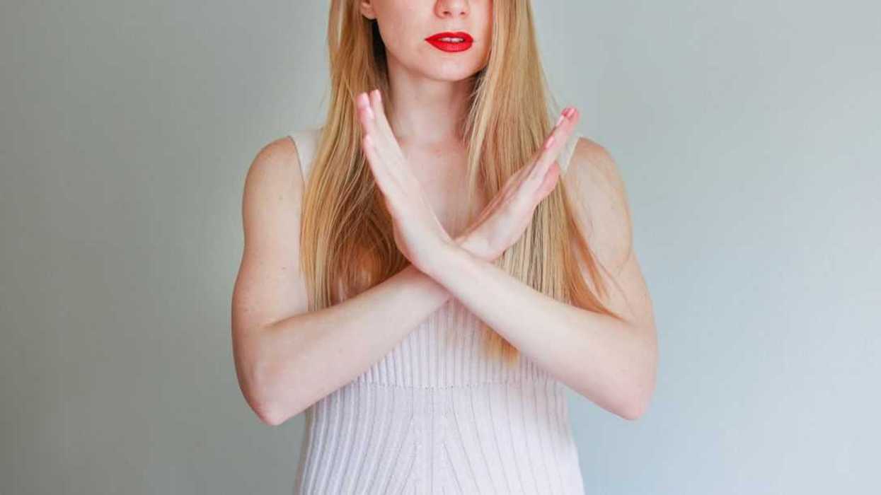 Photo of mature pretty woman crossed hands show no stop forbidden symbol isolated background.