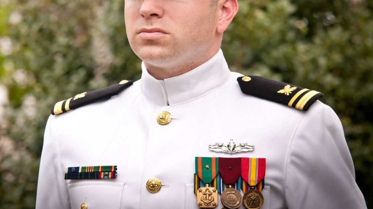 Portrait of male Naval Officer in Winter Whites Uniform Outside