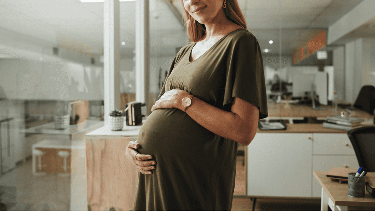 Pregnant woman holding her belly
