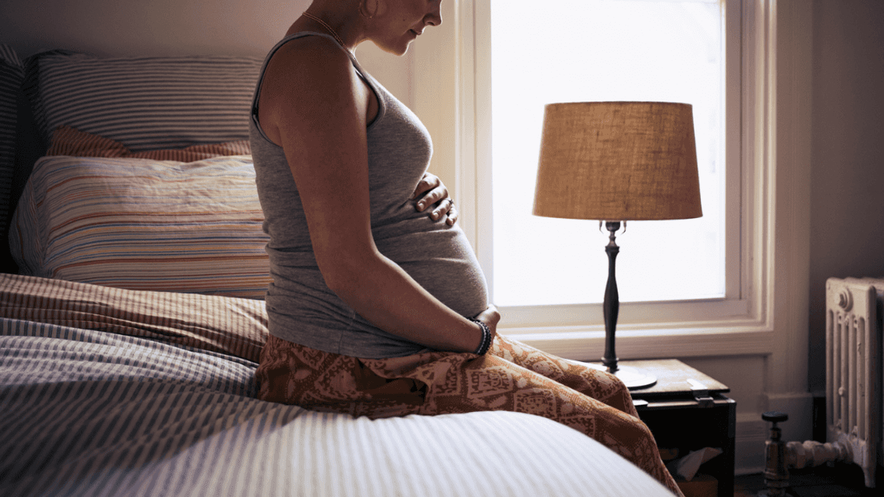 Pregnant woman in bedroom