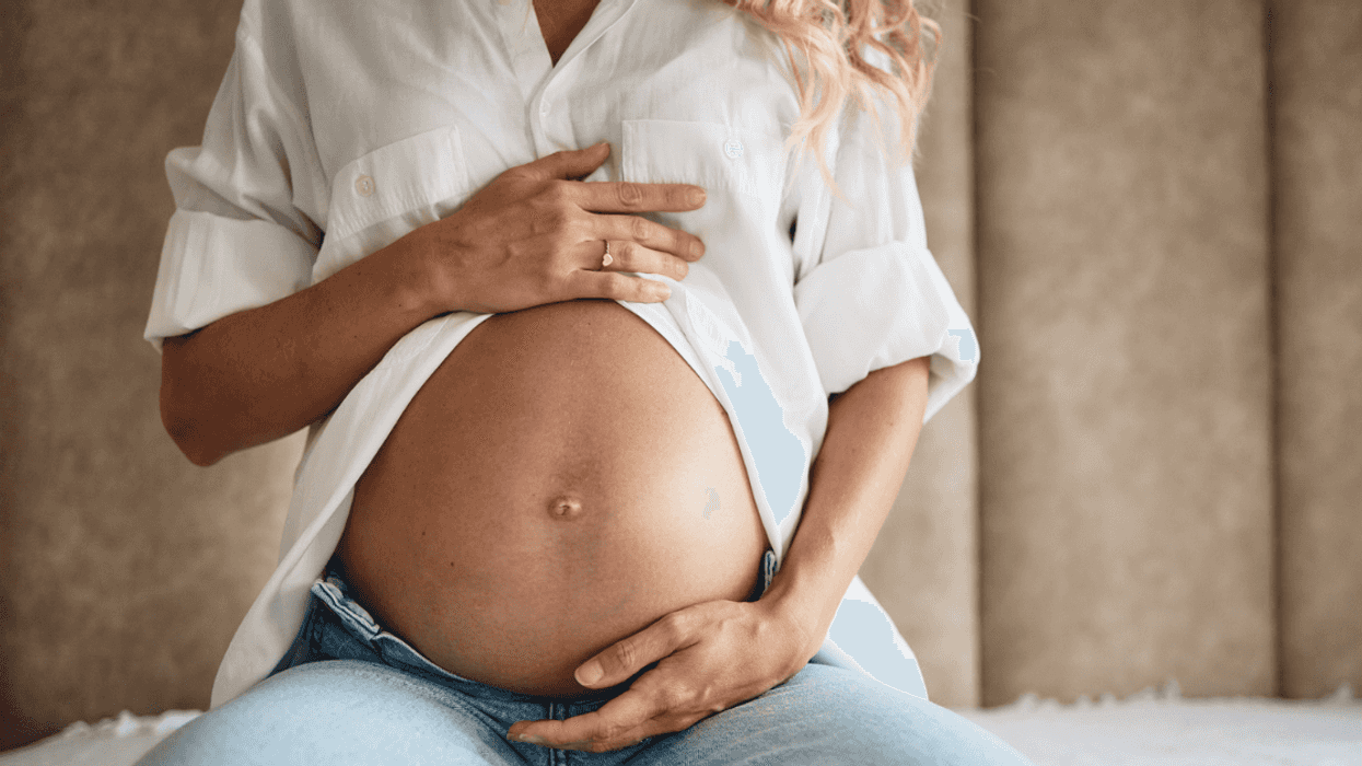 Pregnant woman sitting in a hotel